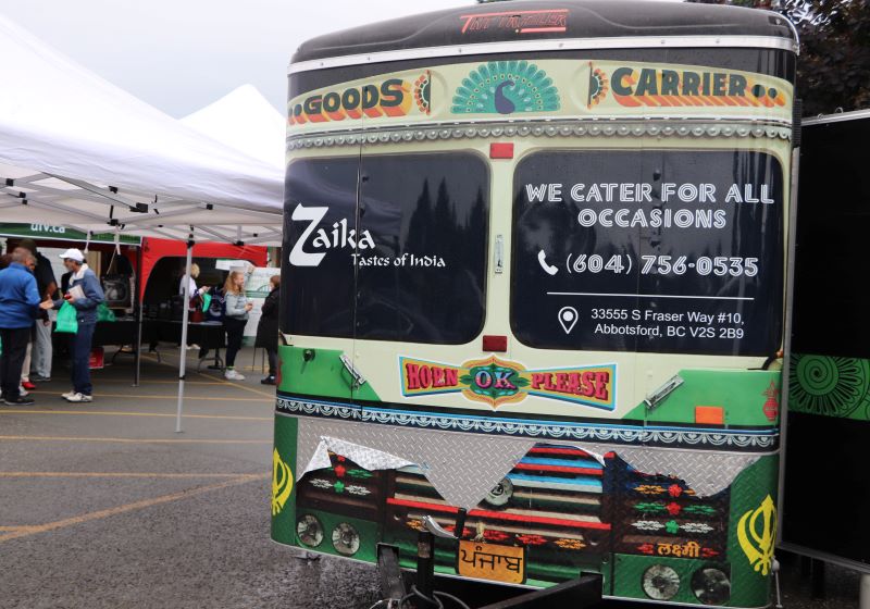 A colourful bus with the Zaika restaurant logo