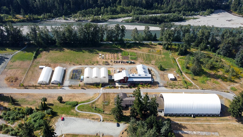 Greenhouses and demonstration barn viewed from above at Chilliwack campus