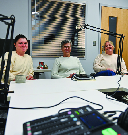 Thumbnail of Iris Lesser and Amber Johnston sitting in front of microphones with Martha Dow
