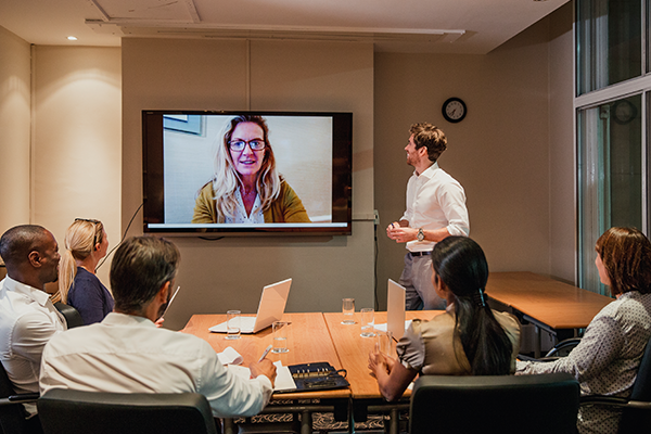 Group of business people having a video conference meeting.