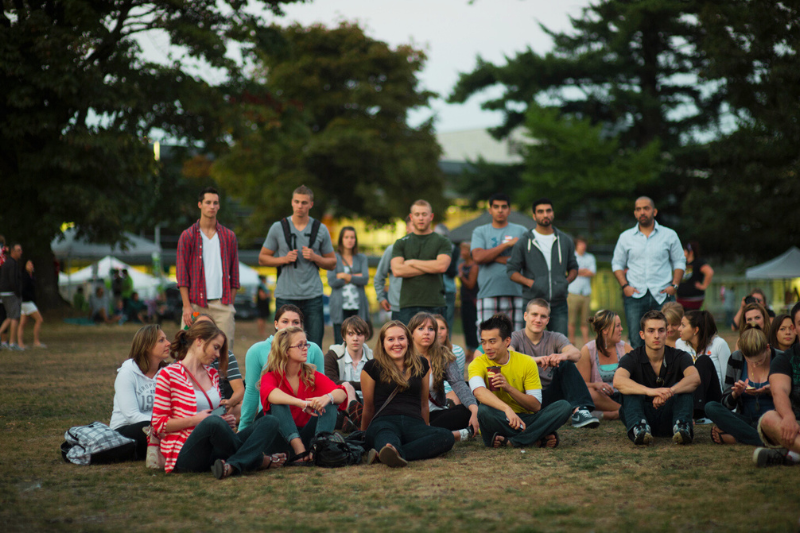 group photo of students hanging out on the greenspace at the Chilliwack campus, outside