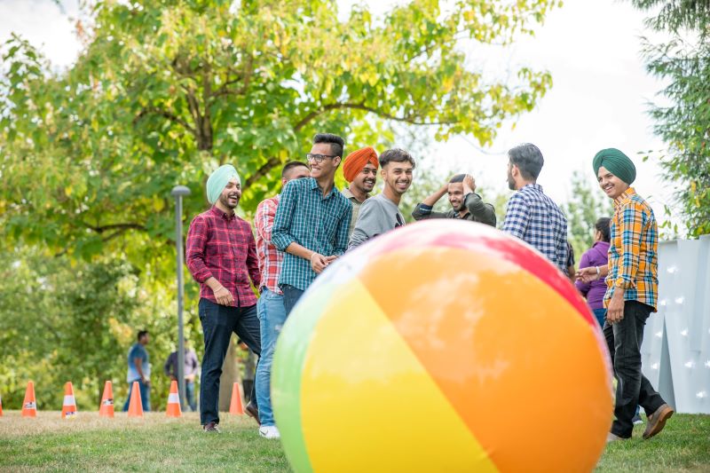 Students on the green for orientation with a giant beach ball