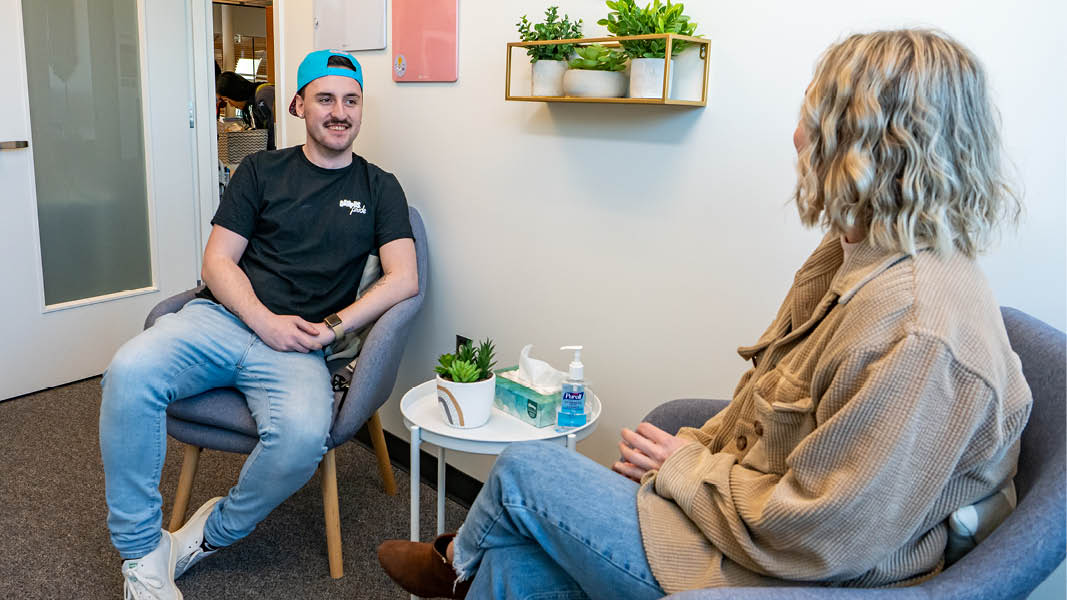 Two students chat in the Wellness centre